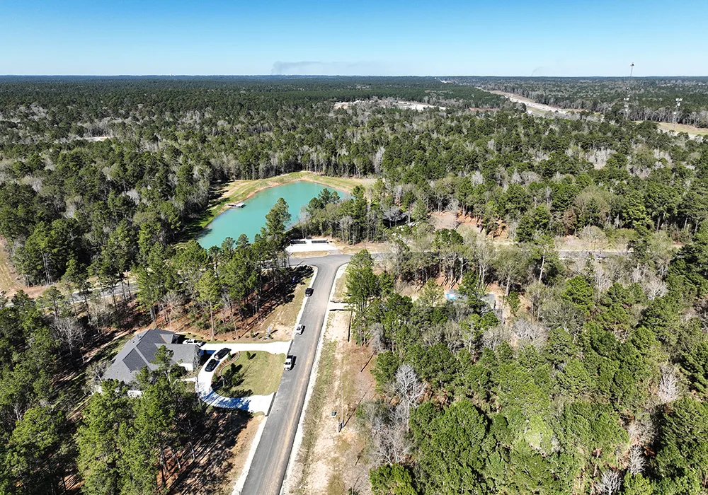 Couple walking on a wooded trail near Sam Houston National Forest in Texas.